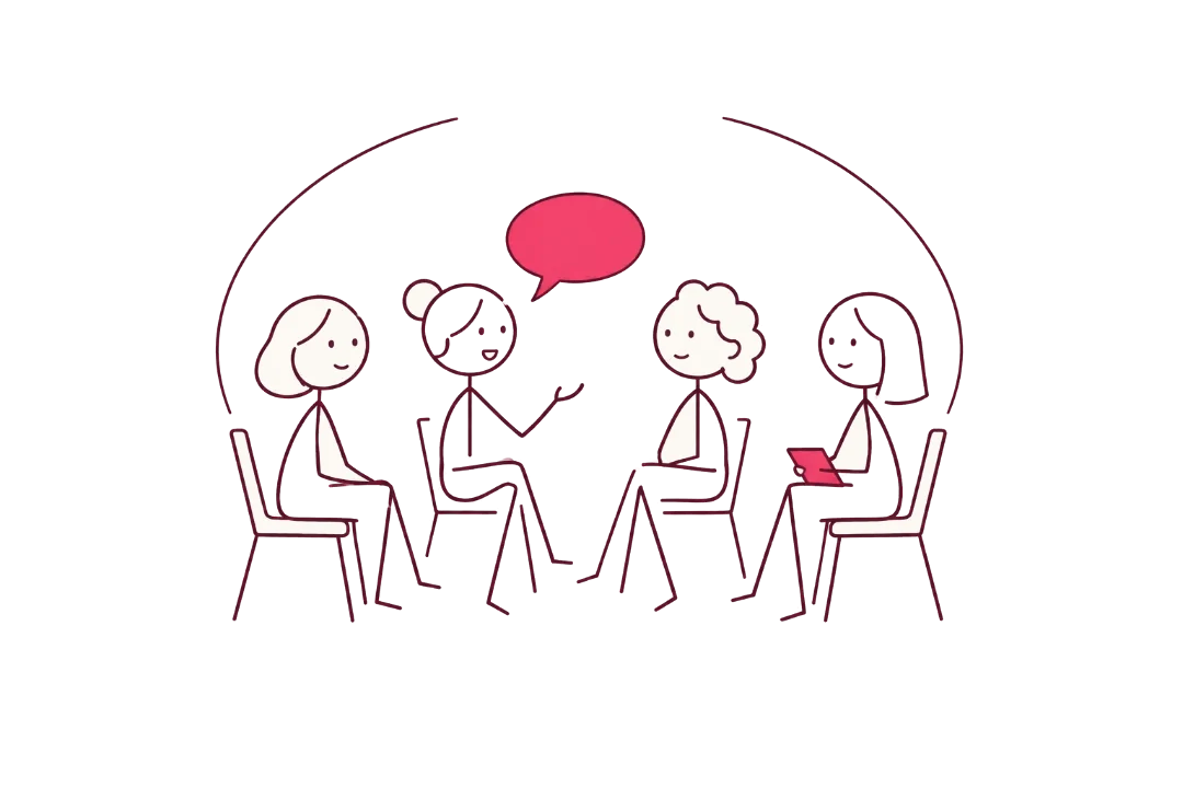Quatre femmes assises en cercle échangent.
